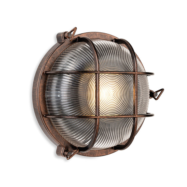 Round bulkhead light with a bronze finish and a ribbed glass diffuser