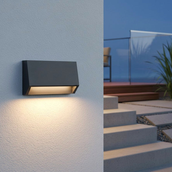 Rectangular outdoor wall light in dark grey with warm light shining downwards