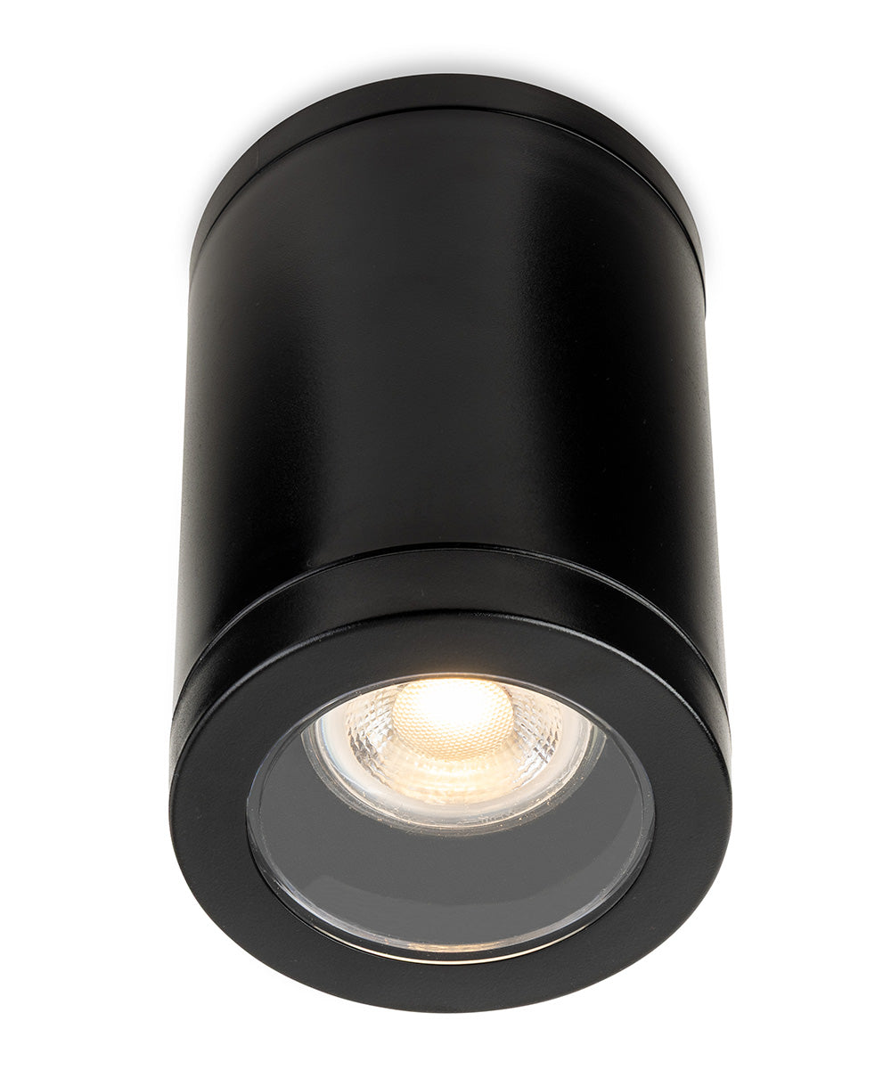 Black cylindrical ceiling light with a glowing bulb