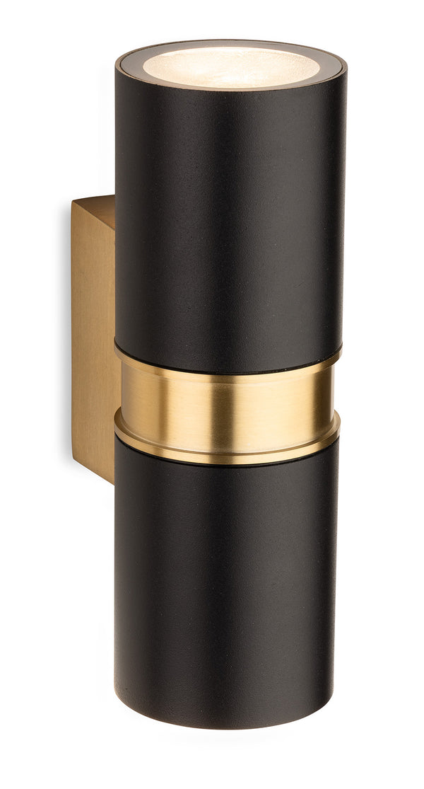 Black cylindrical wall light with a brass band and brass mounting bracket