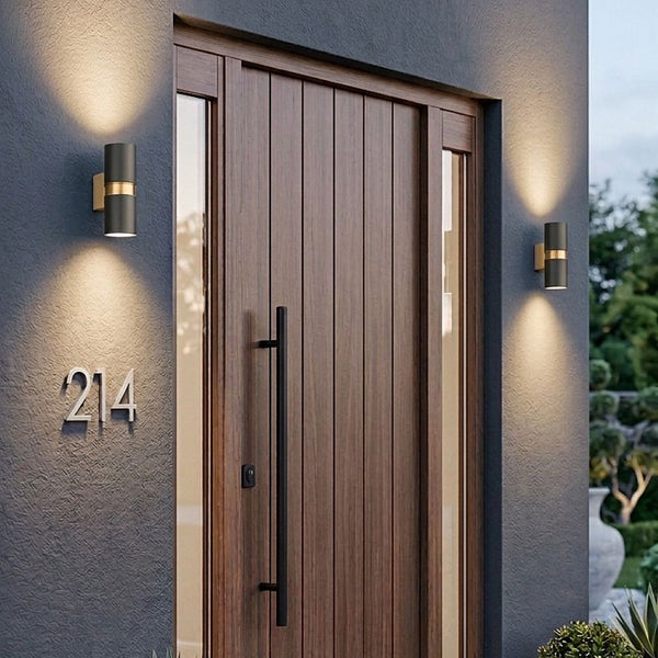 Modern outdoor wall lights illuminating a wooden front door and house number 214