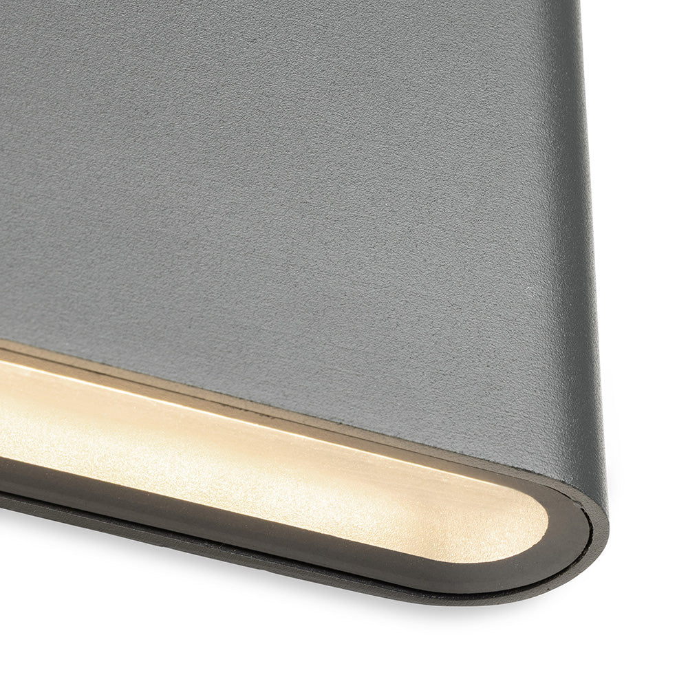 Close up of a gray wall light with a warm white LED strip