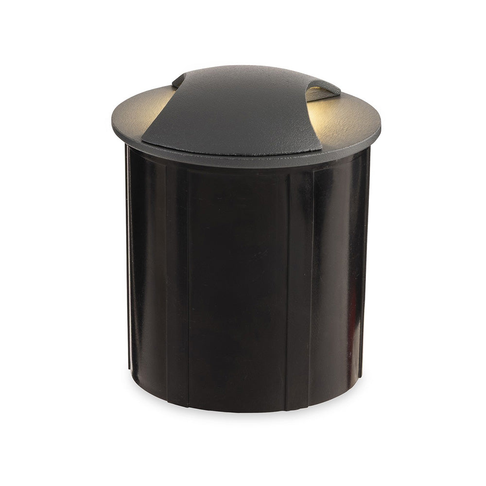 Black round ground light with a curved top emitting light