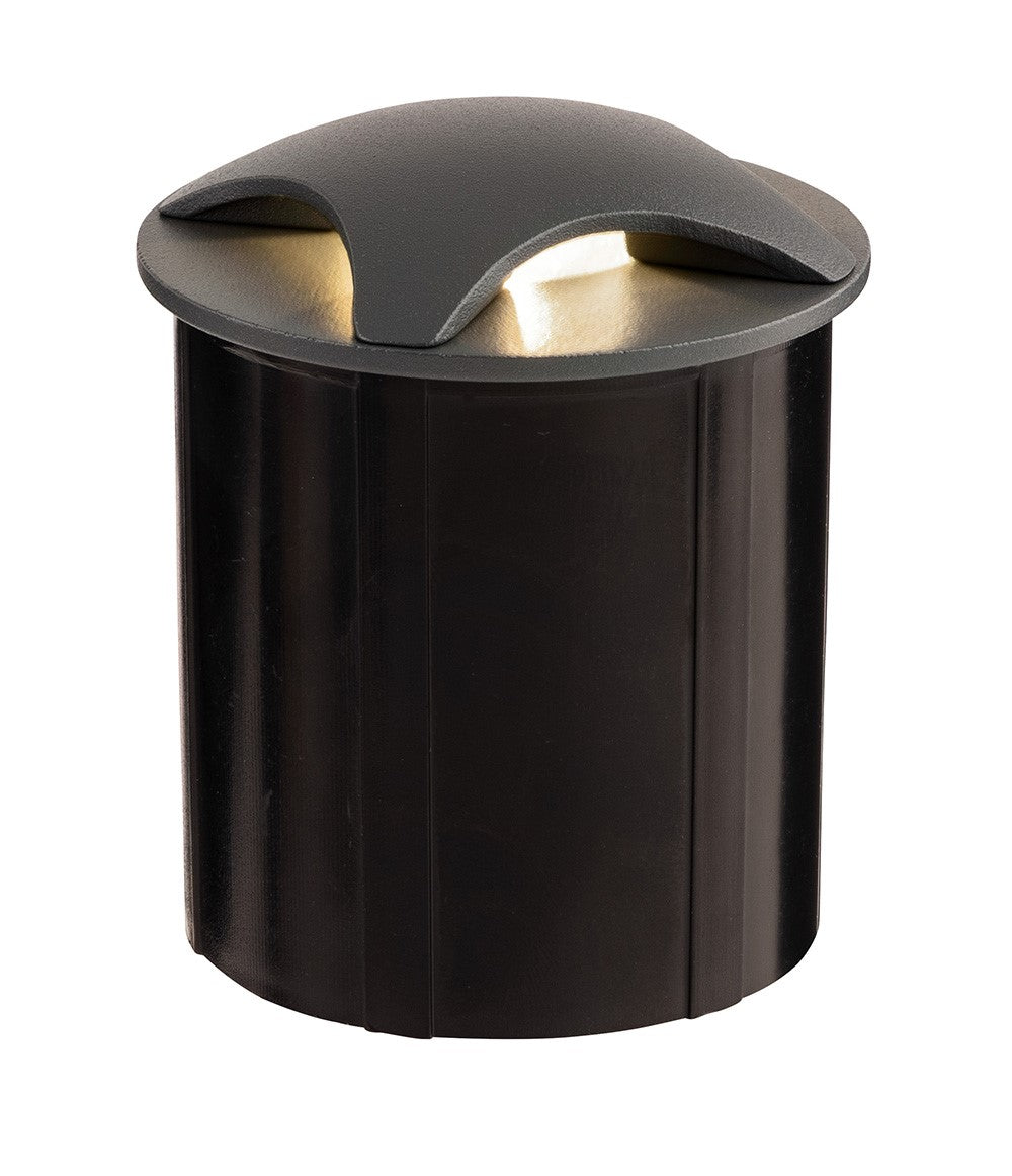 Black cylindrical outdoor light with a curved grey top emitting a warm glow