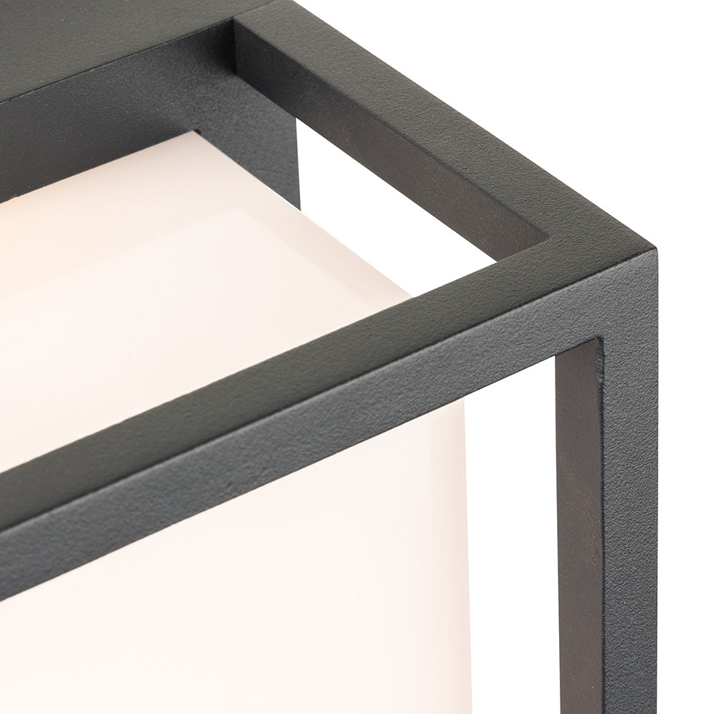 Close-up of a black metal frame surrounding a glowing white light fixture