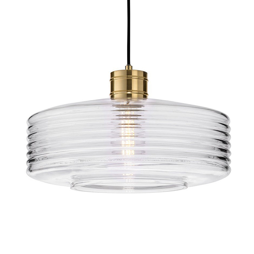 Clear ribbed glass pendant light with a brass fitting and exposed bulb
