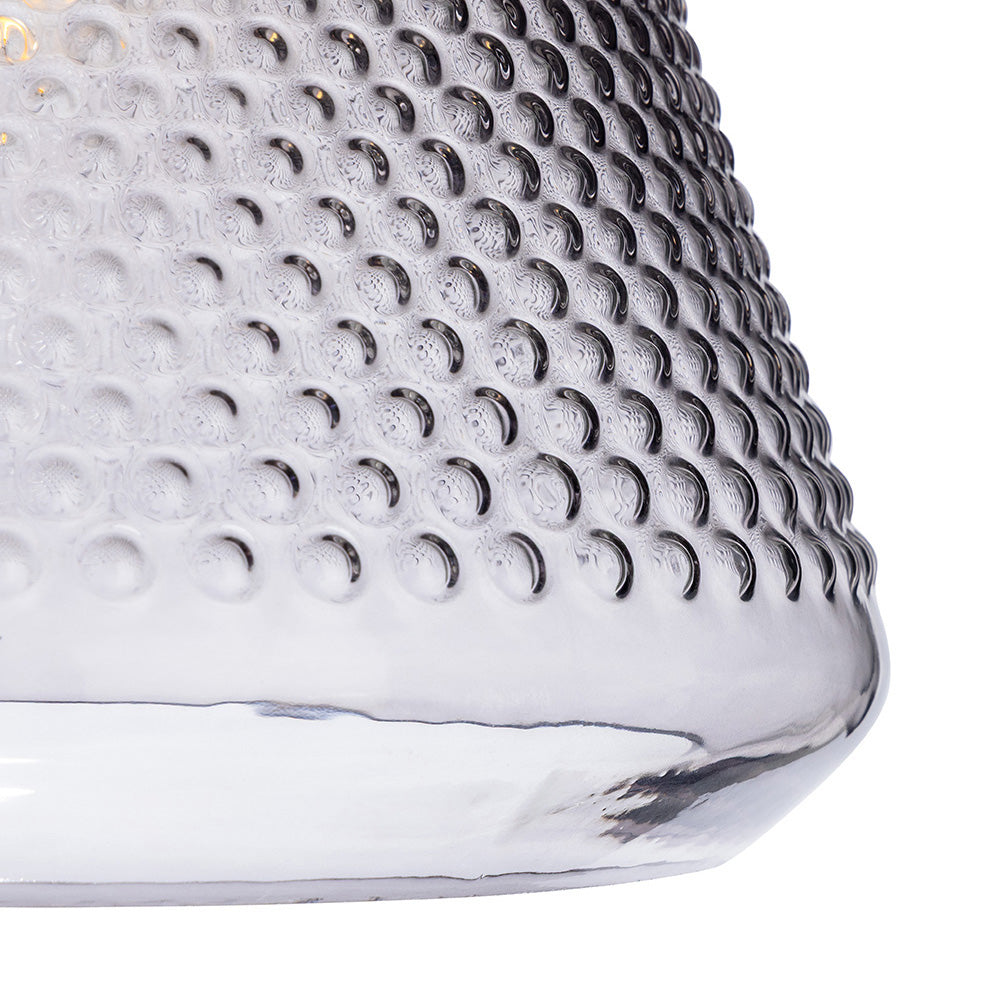 Close up of a silver glass pendant light with a textured surface