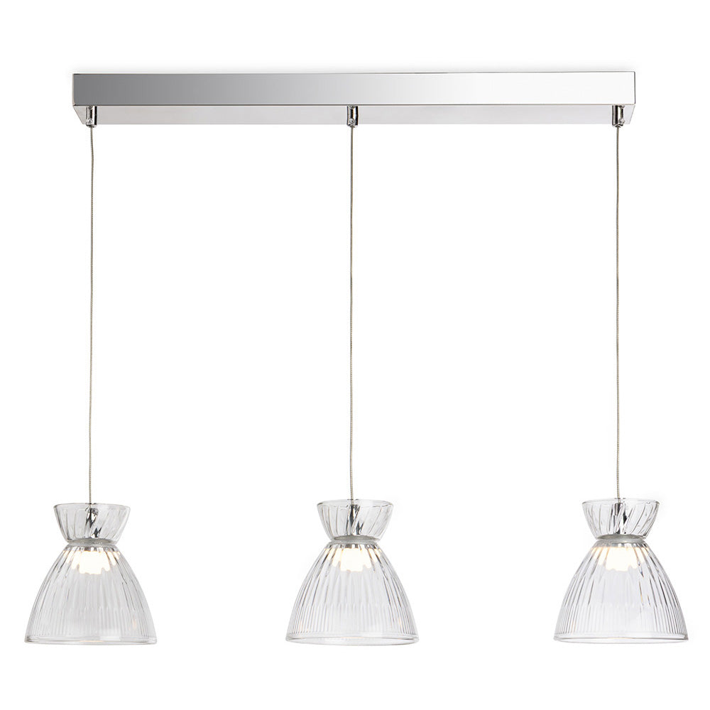 Three clear glass pendant lights with ribbed shades hang from a rectangular chrome bar