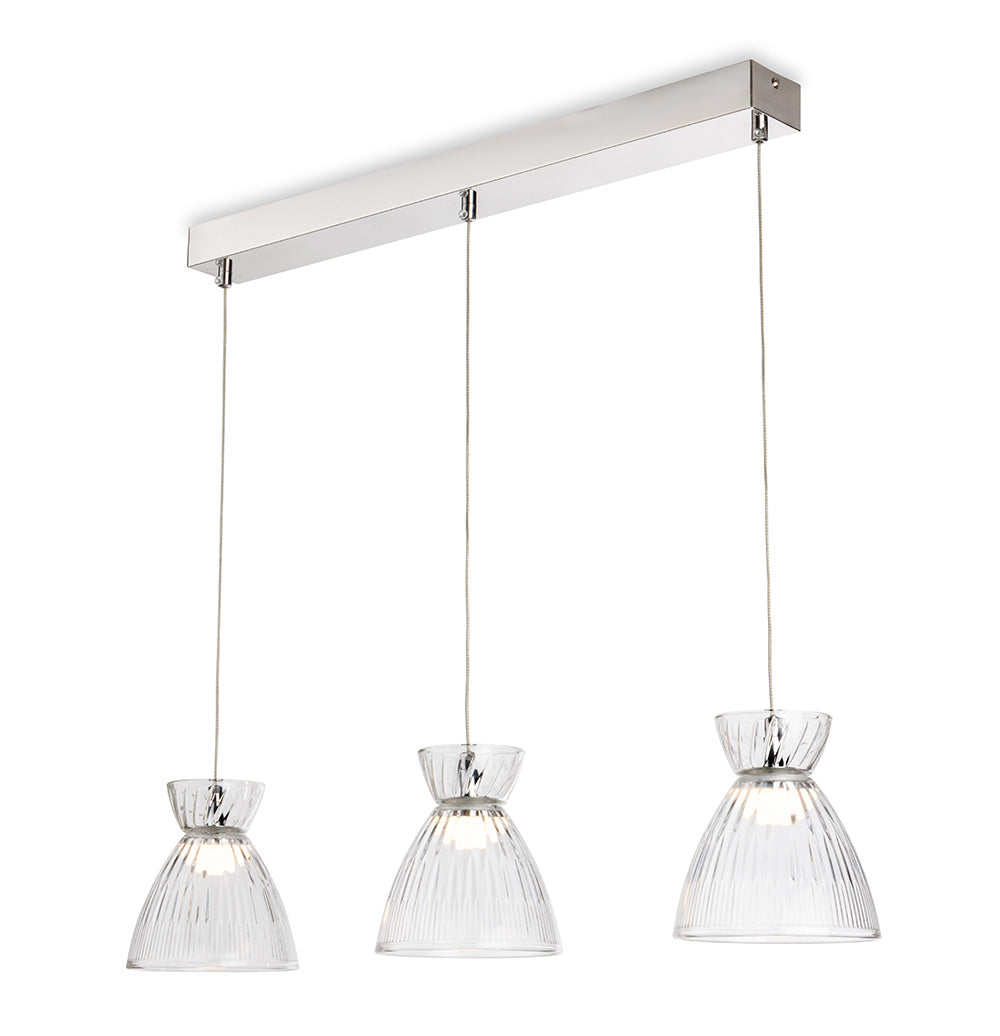 Three clear glass pendant lights with ribbed shades hang from a rectangular chrome bar