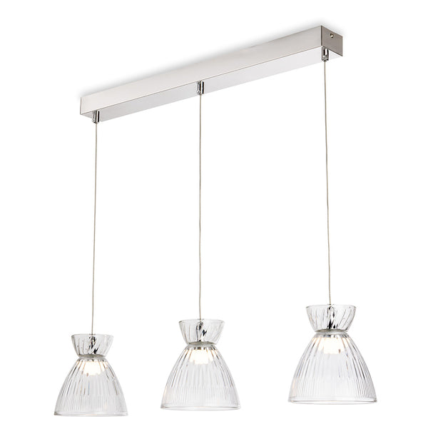 Three clear glass pendant lights with ribbed shades hang from a rectangular chrome bar