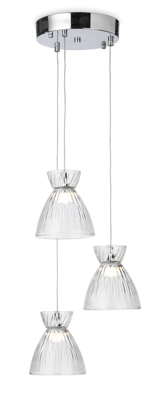 Three clear glass pendant lights with ribbed shades hang from a chrome ceiling plate