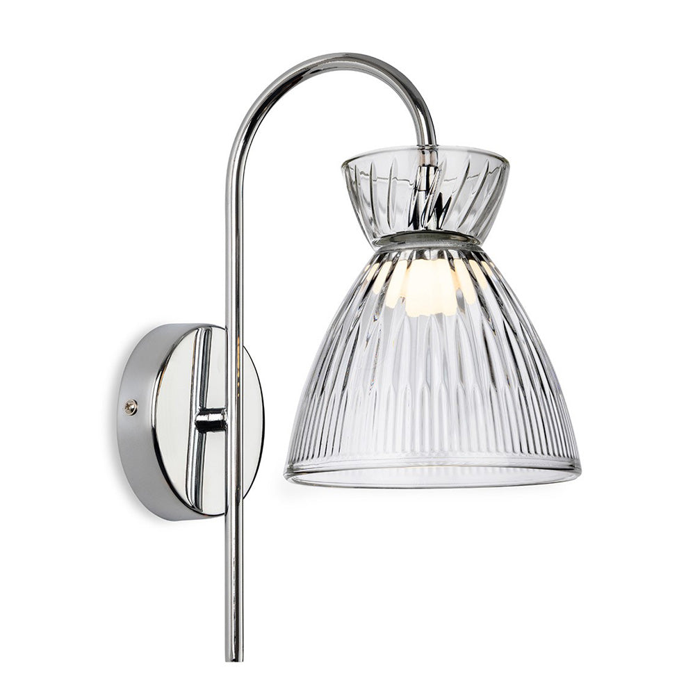 Chrome wall light with a curved arm and a ribbed glass shade