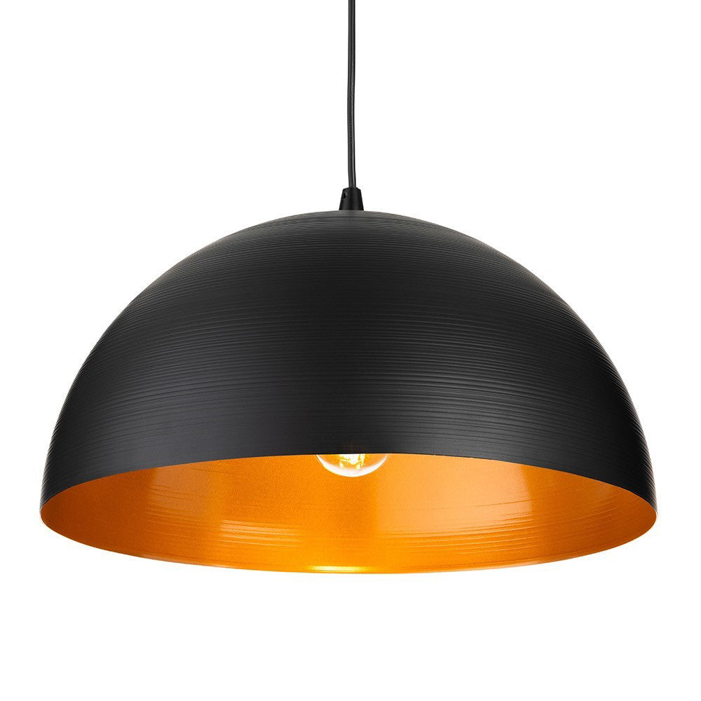 Black dome pendant light with a gold interior and a visible light bulb
