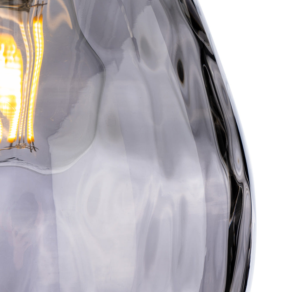 Close up of a light bulb with a wavy glass shade