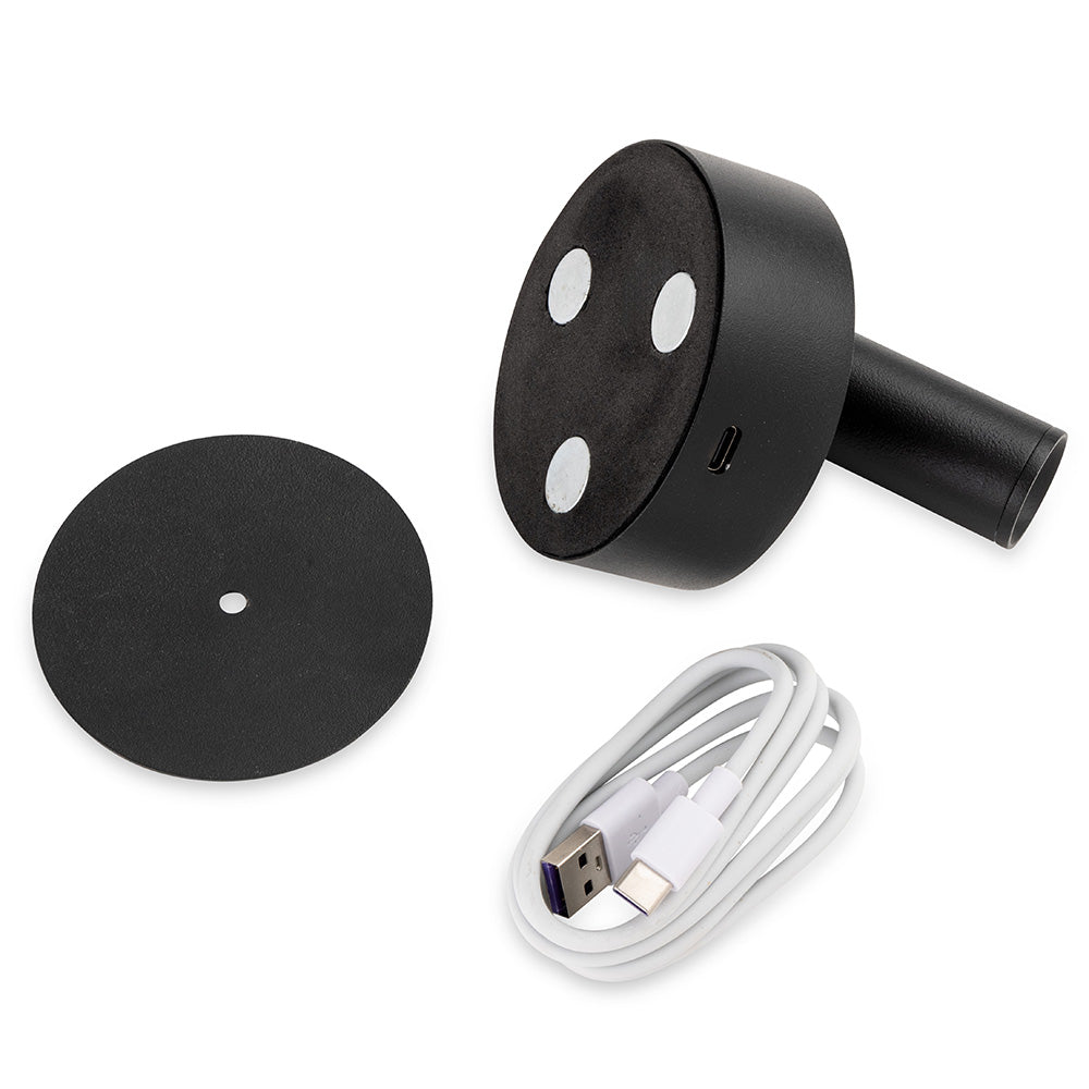 Black magnetic base with three white magnets, a black circular plate, and a coiled white USB-C cable