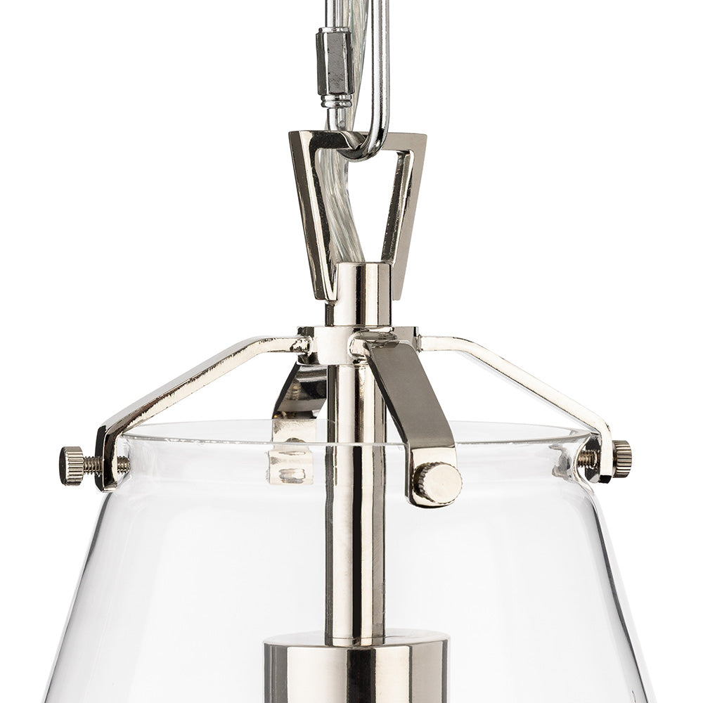 Close up of a clear glass pendant light with polished nickel hardware
