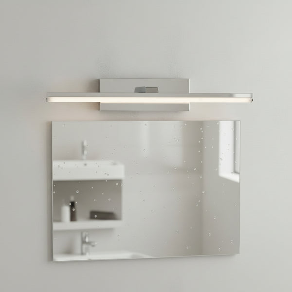Rectangular mirror with water droplets and a horizontal light fixture above it