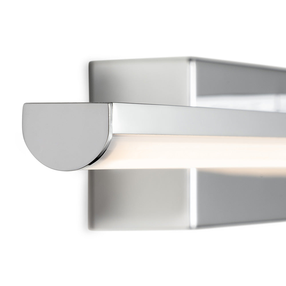 Close-up of a chrome wall light with a half-circle end cap and an illuminated LED strip