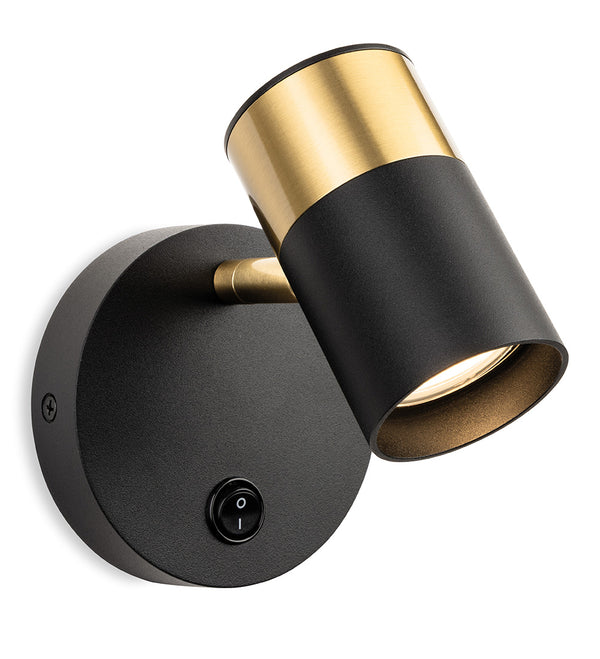 Black and brass wall-mounted spotlight with a toggle switch