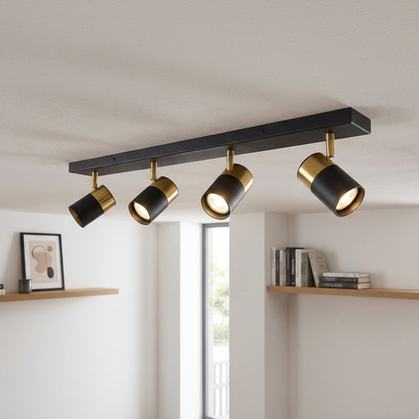Black and gold ceiling spotlight bar with four adjustable lights