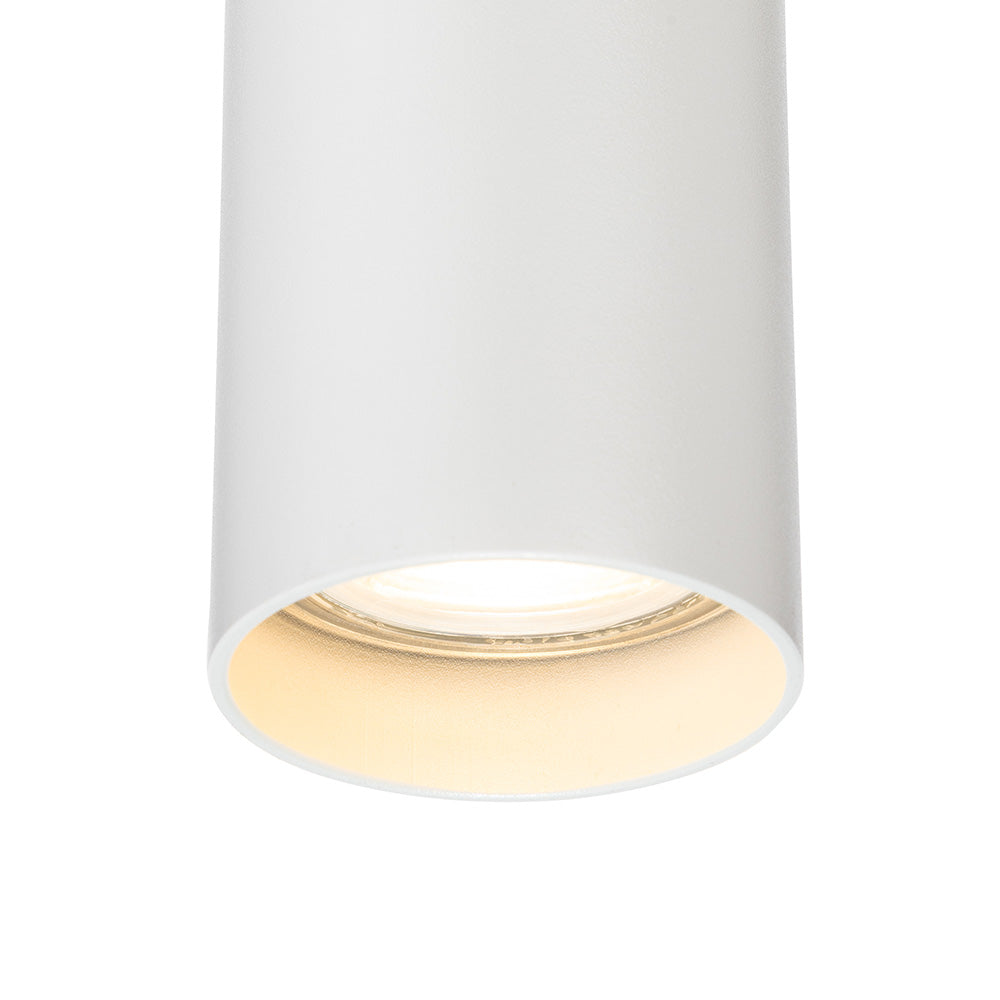 White cylindrical ceiling light fixture with a warm glow