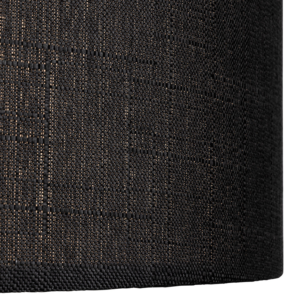 Close up of a black woven fabric with a subtle gold shimmer