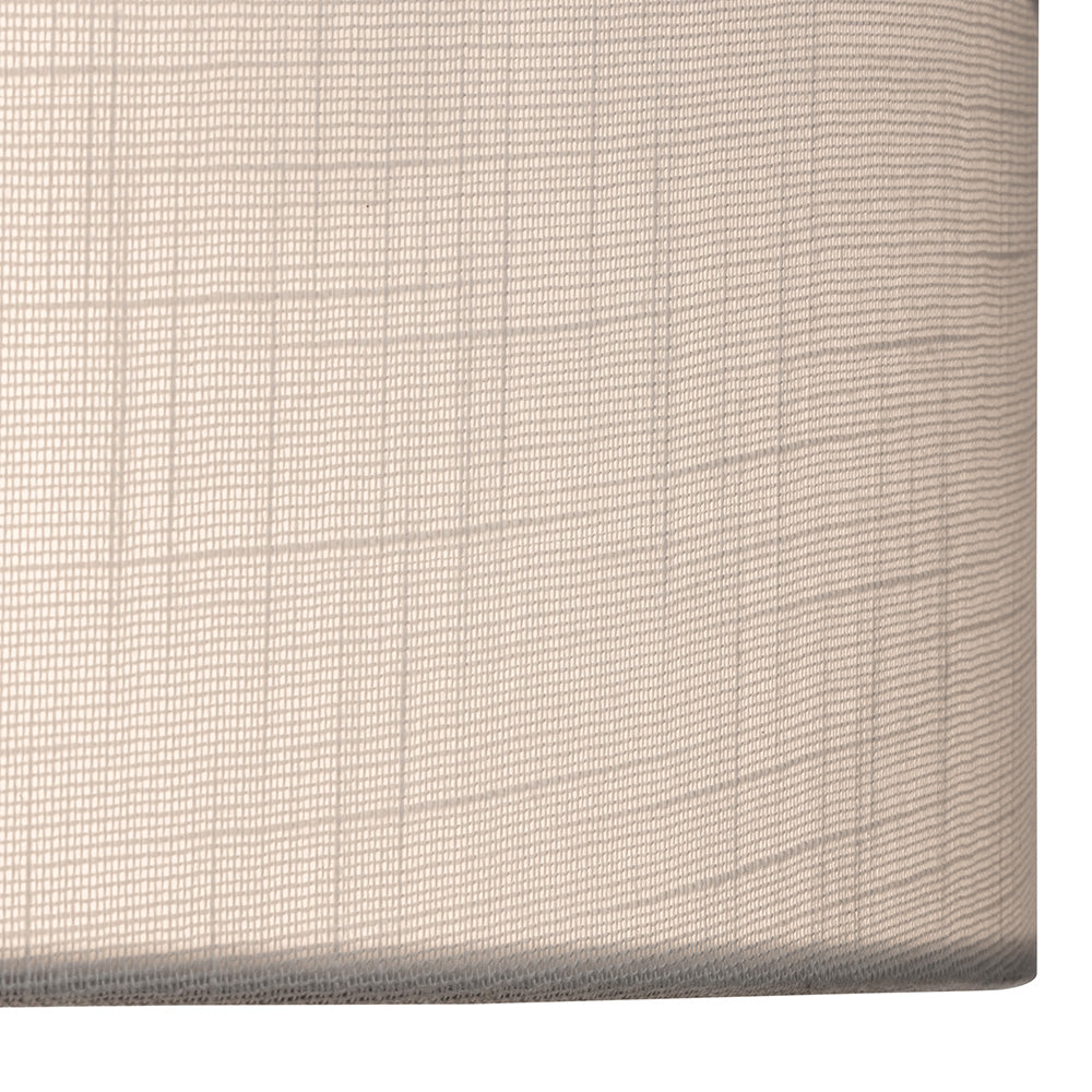 Close up of a light beige fabric with a subtle grid pattern