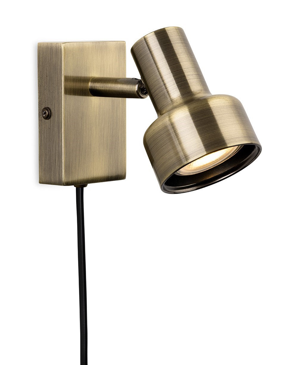Brass wall light with adjustable spotlight and visible black cord
