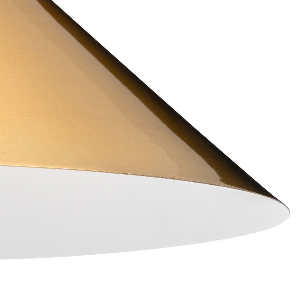 Close up of a gold and white conical lampshade