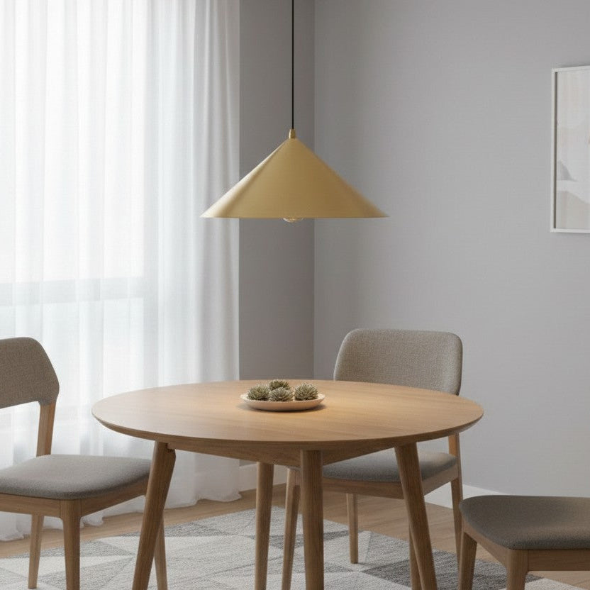 Dining room with a round wooden table, three chairs, and a gold conical pendant light