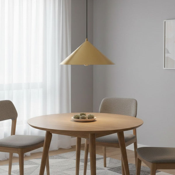 Dining room with a round wooden table, three chairs, and a gold conical pendant light