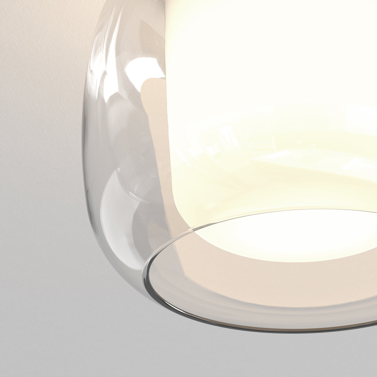 Close up of a clear glass pendant light with a bright white light source inside