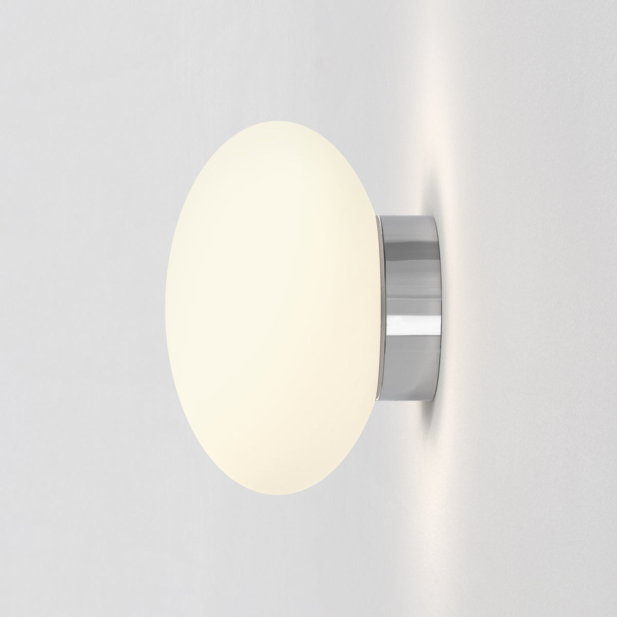 White spherical wall light with a chrome base