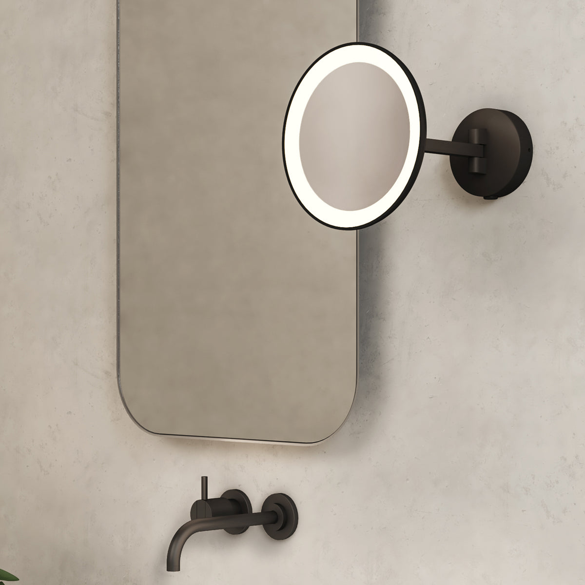 Bathroom with a large rectangular mirror, a round illuminated magnifying mirror, and a wall-mounted faucet