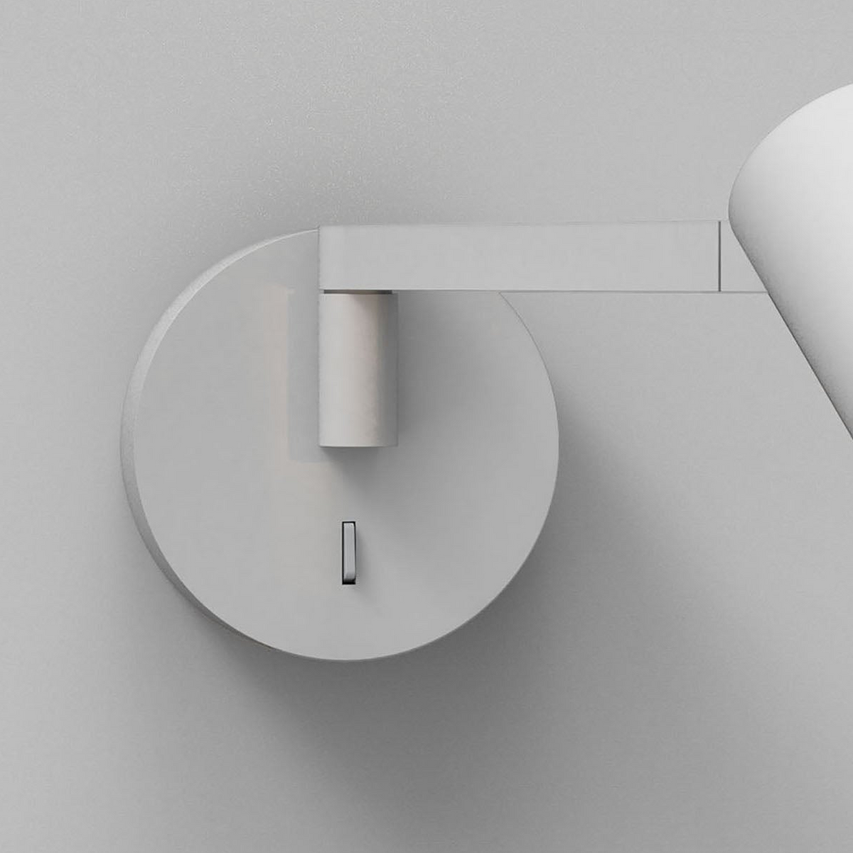 White wall lamp with a circular base and a rectangular arm extending to the right