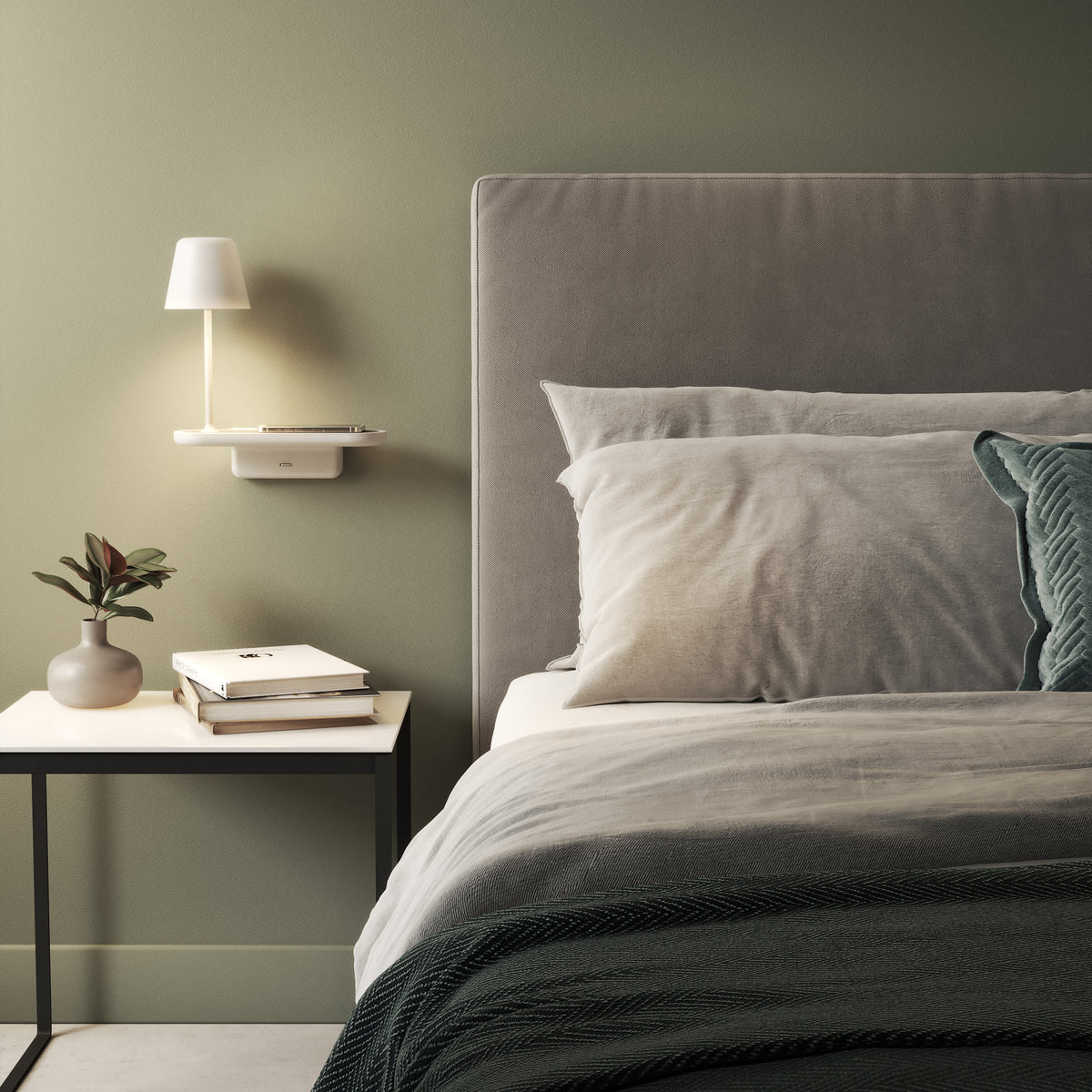 Bedroom with a bed, side table, and wall-mounted shelf with a lamp