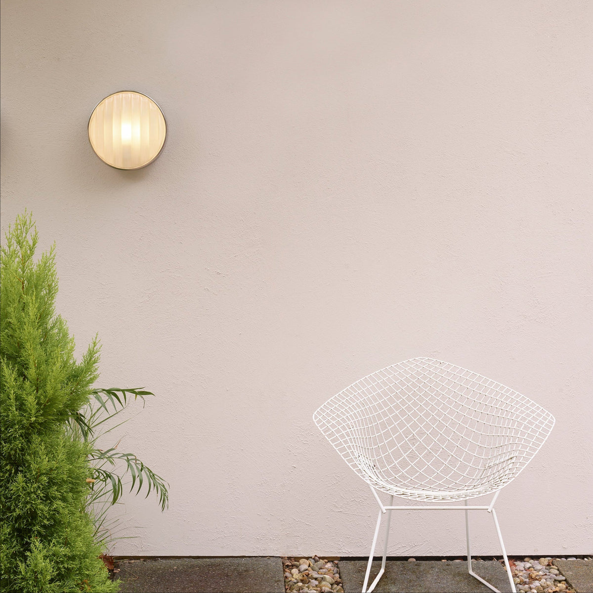 Astro Montreal Round 300 IP44 Exterior Wall Light in Brushed Stainless Steel on a wall