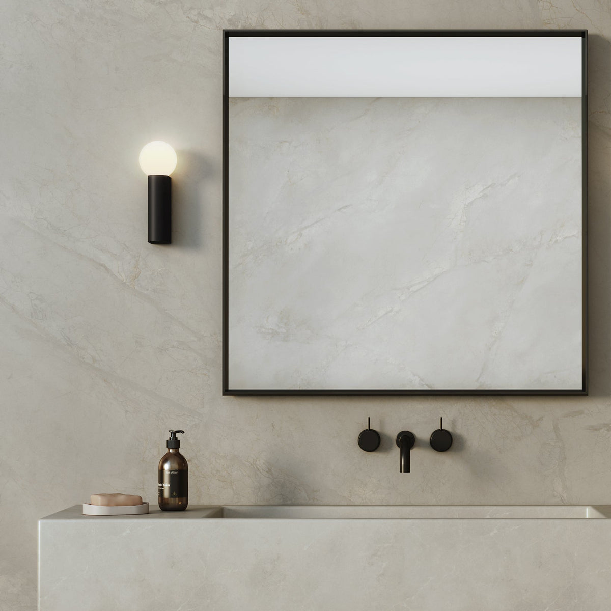 Bathroom vanity with a light grey marble countertop, black faucet, and a large mirror with a light strip