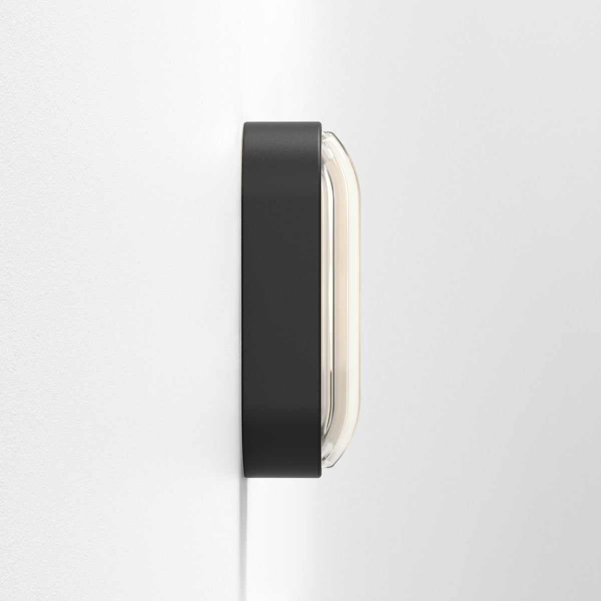Astro Montreal Oval IP44 Exterior Wall Light in Textured Black on a white wall