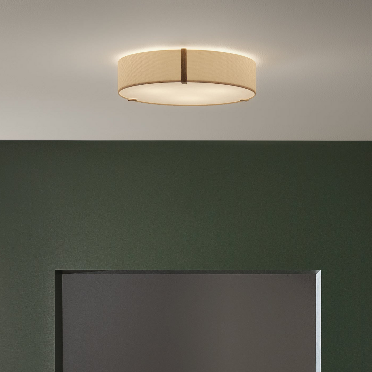 Round ceiling light with a beige fabric shade and dark wood accents