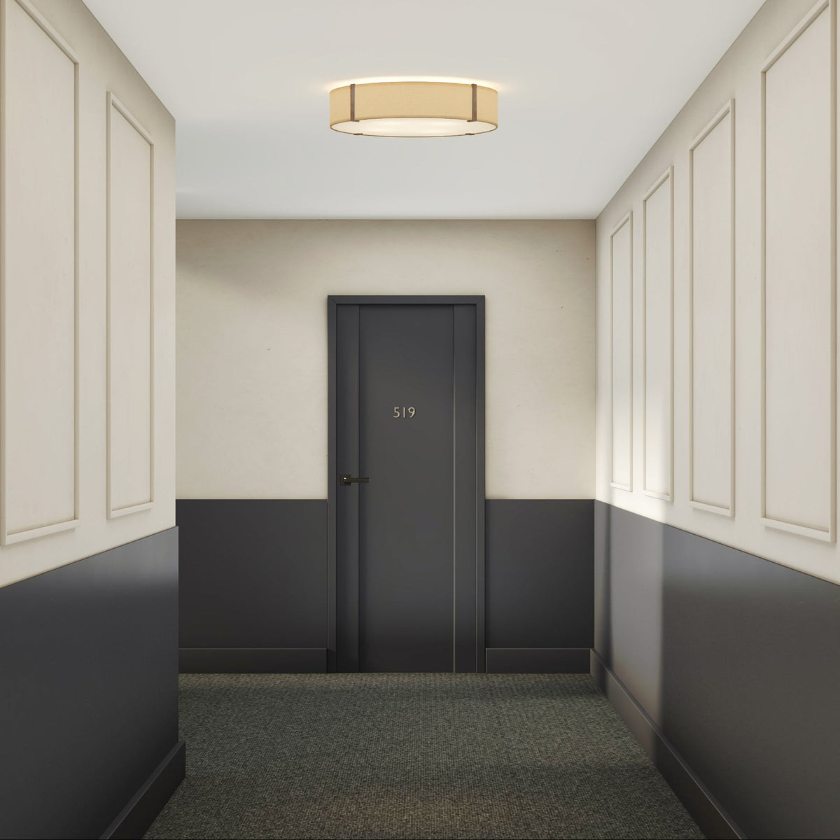Hallway with dark gray door number 519, light gray walls with white trim, and a round ceiling light