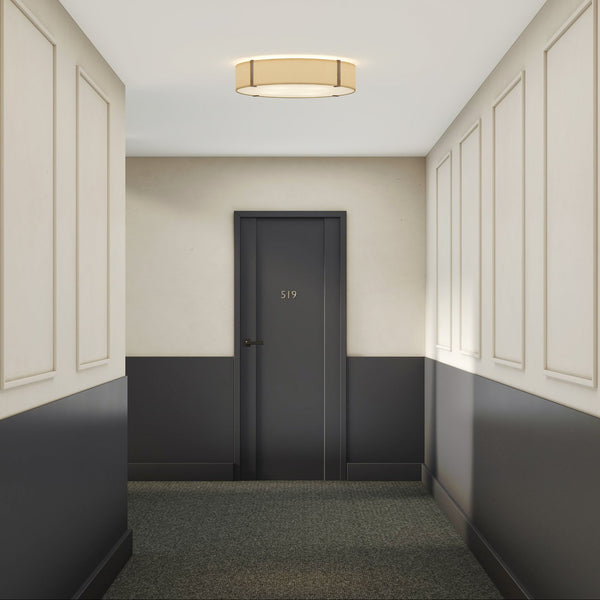 Hallway with dark gray door number 519, light gray walls with white trim, and a round ceiling light