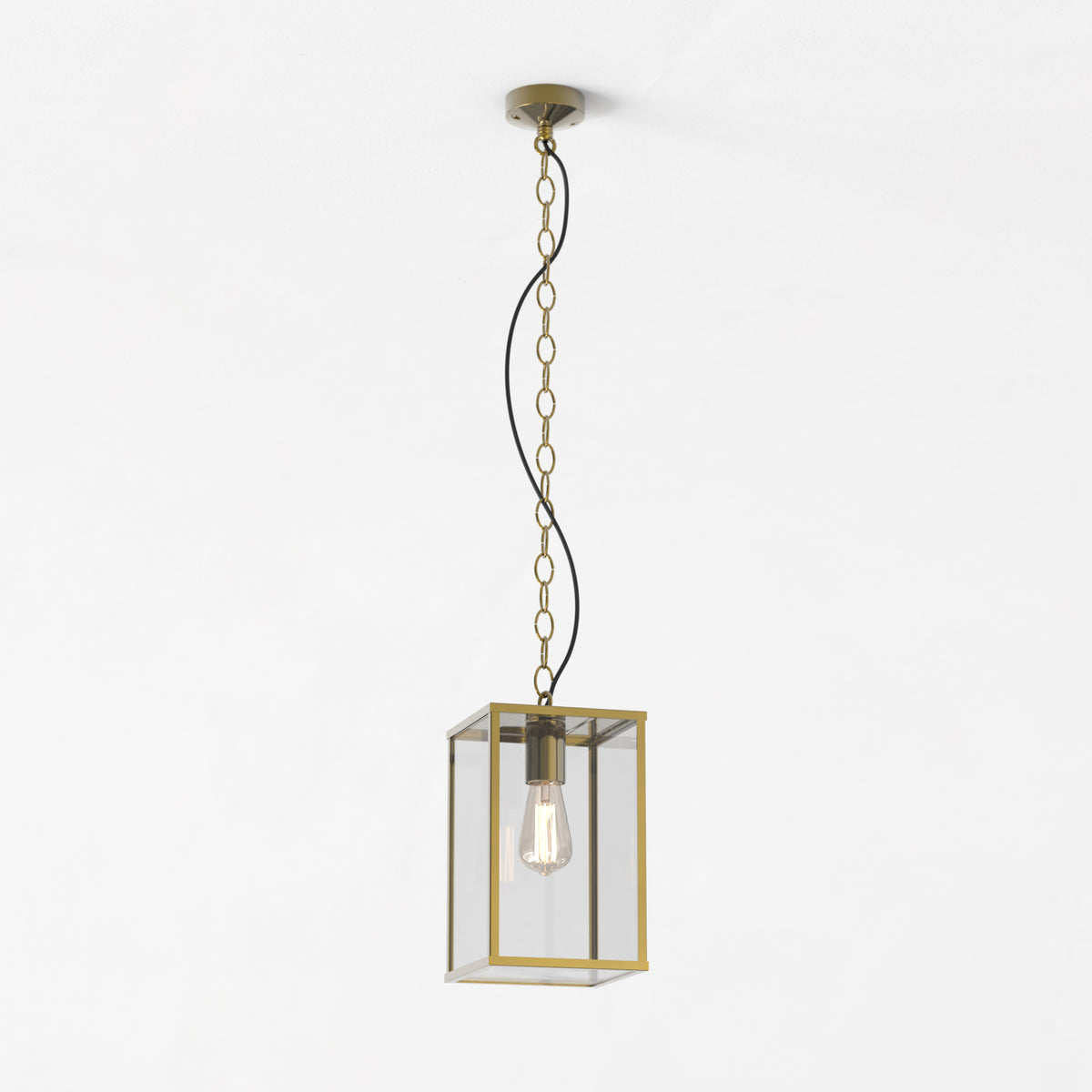Brass and glass rectangular pendant light with a single exposed bulb