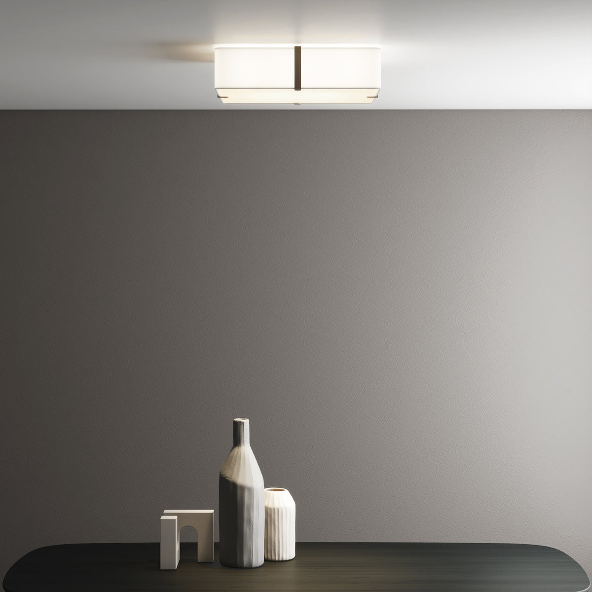 Rectangular ceiling light with a white shade and a dark metal band in a modern room
