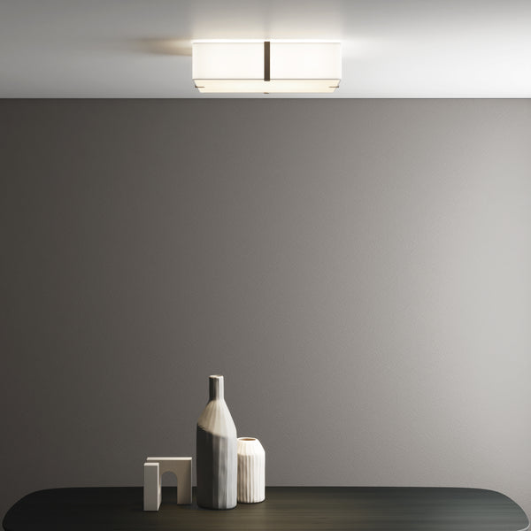 Rectangular ceiling light with a white shade and a dark metal band in a modern room