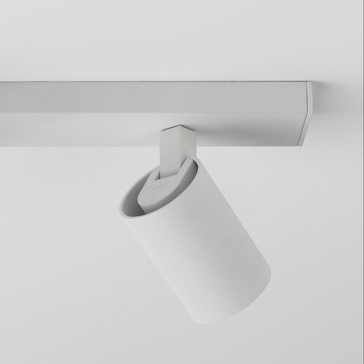 Astro branded white cylindrical ceiling spotlight