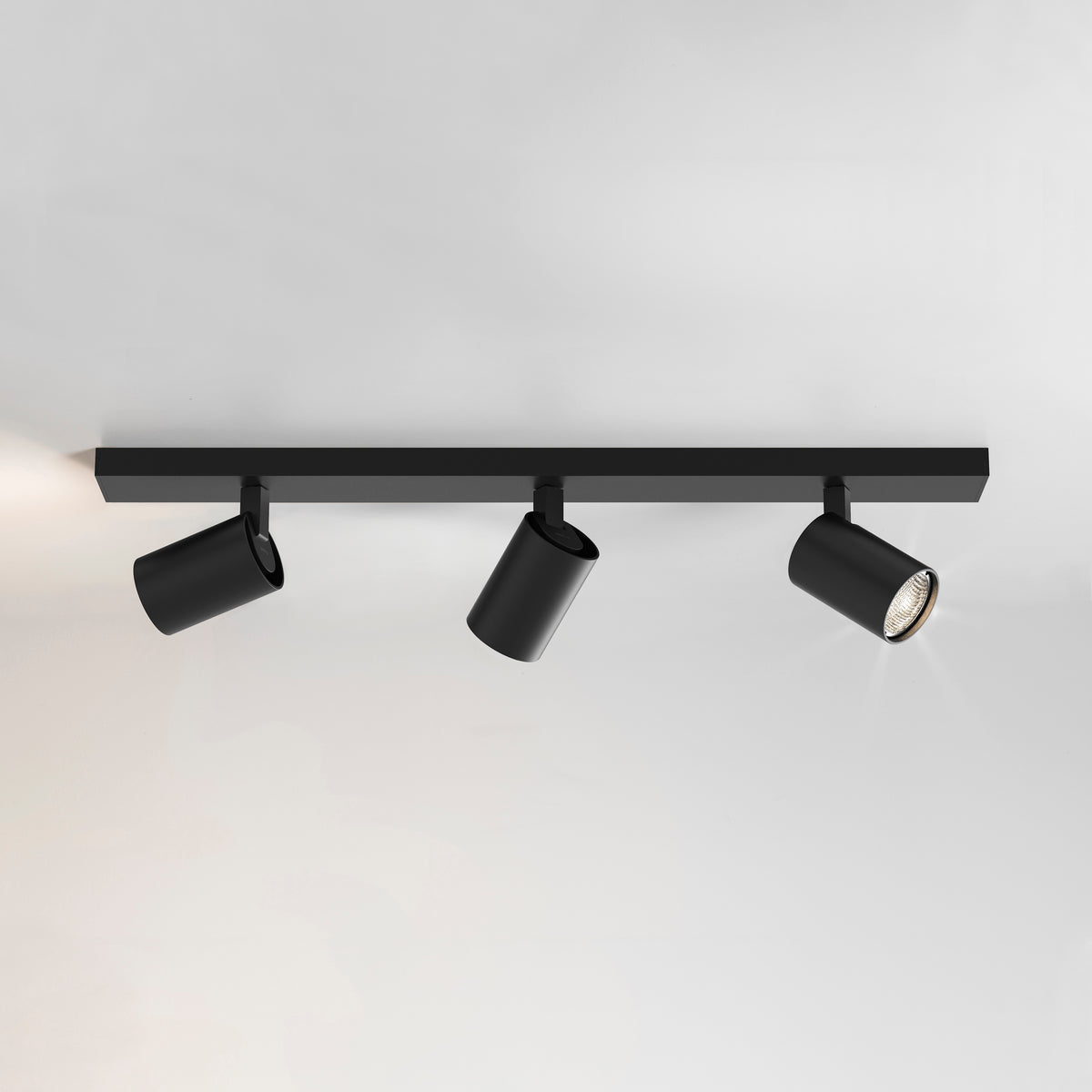 Black ceiling track light with three adjustable spotlights