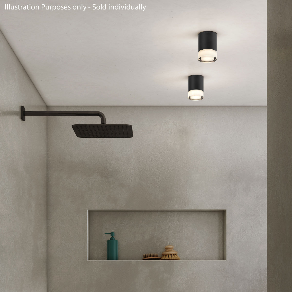 Two black cylindrical ceiling lights illuminate a shower area with a dark shower head and a recessed shelf