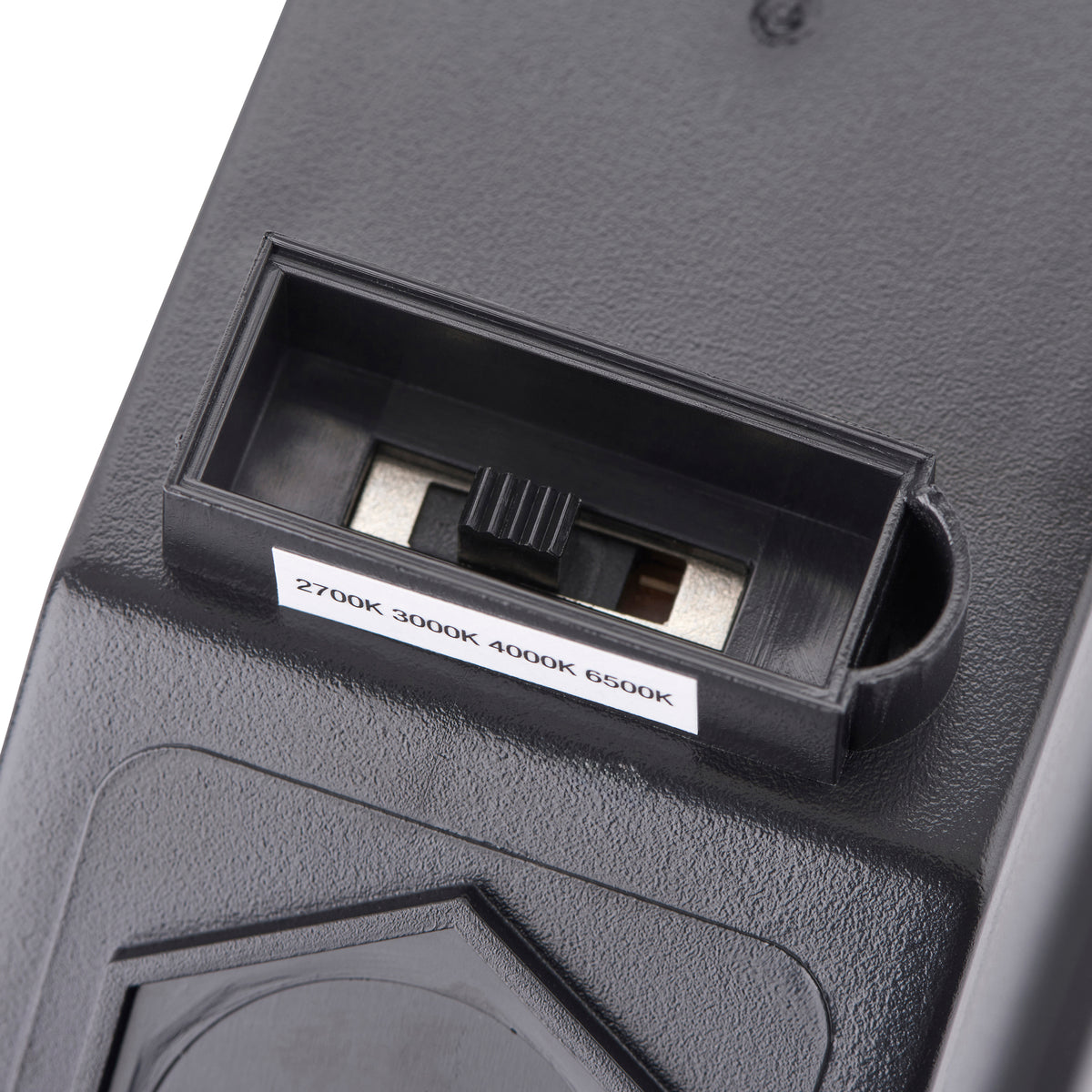 Close up of a black switch with a white label that reads 2700K 3000K 4000K 6500K