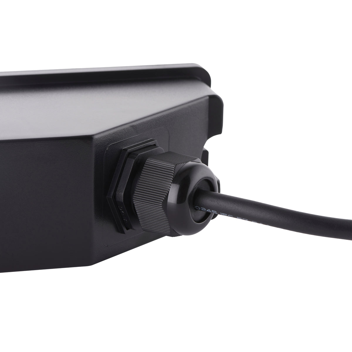 Black cable gland with a black cable attached to a black electrical box